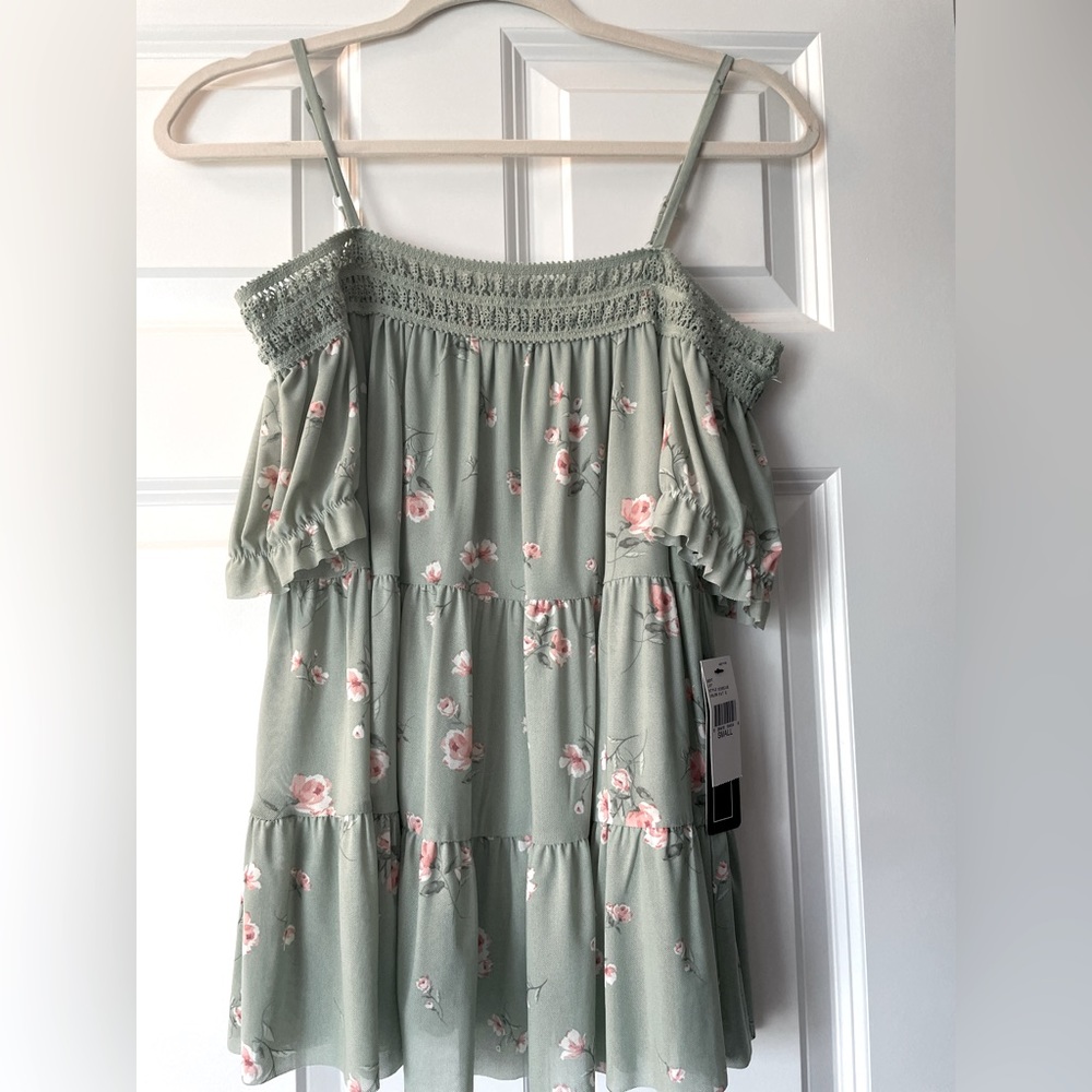 Brand New!!! Off the shoulder float top with adjustable spaghetti straps.